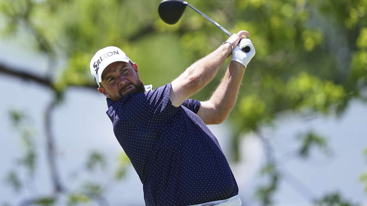 Shane Lowry, of Ireland, hits on the first hole during the third round of the Truist Championship golf tournament at the Philadelphia Cricket Club, Saturday, May 10, 2025, in Flourtown.