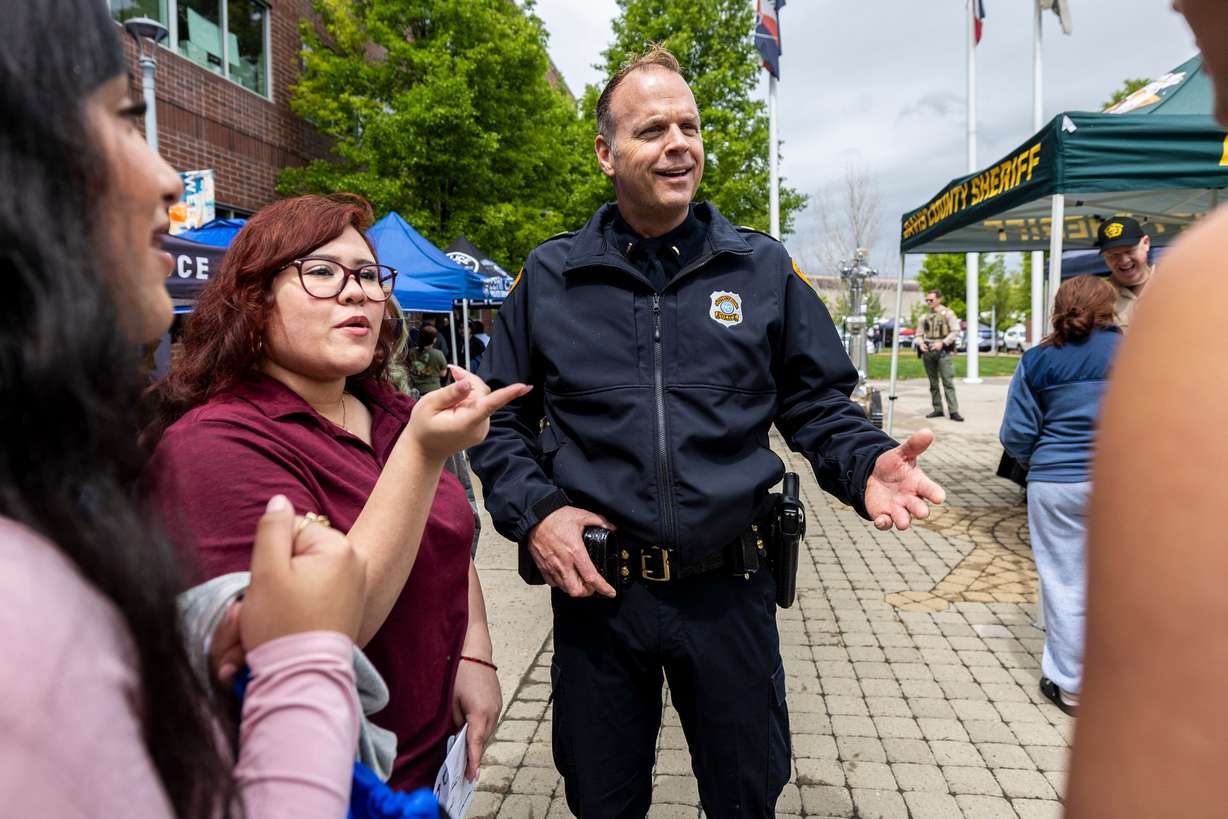 Salt Lake City Police Department Lt. Cody Lougy talks with some of his students, including East High School senior Arely Escobedo, during the first Find Yourself in Utah Law Enforcement Career Day held outside the Peace Officers Standards and Training Center on Salt Lake Community College’s Miller Campus in Sandy on April 30.