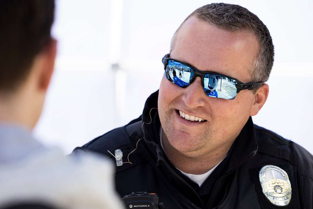 West Valley City Police Department officer Josh Allen shakes hands with a high school student during the first Find Yourself in Utah Law Enforcement Career Day held outside the Peace Officers Standards and Training Center on Salt Lake Community College’s Miller Campus in Sandy on April 30.
