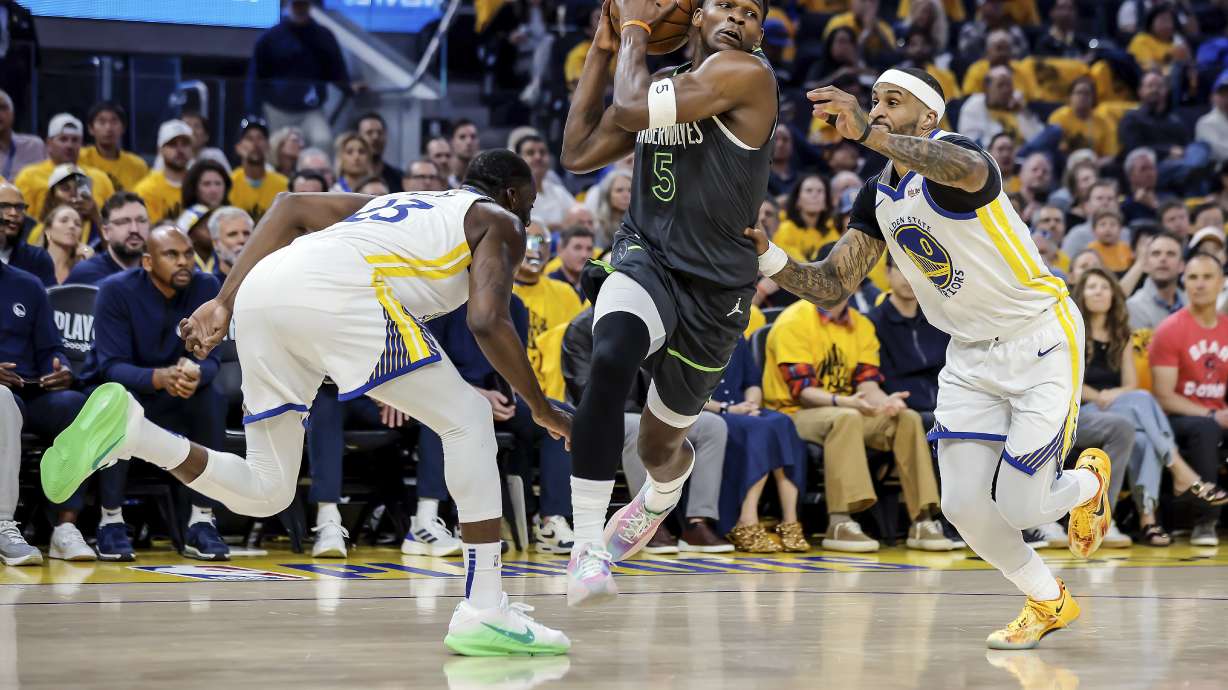 Anthony Edwards (5) of Minnesota Timberwolves drives to the basket between Gary Payton II (0) and Draymond Green (23) of Golden State Warriors in the first half of Game 3 of the Conference Semifinals of the NBA Playoffs at Chase Center in San Francisco., on Saturday, May 10, 2025.