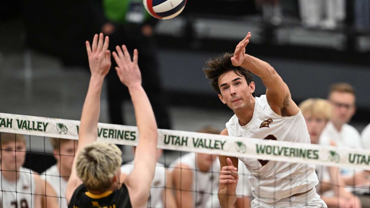 Maple Mountain’s Trey Thornton spikes the ball over Wasatch’s Carter Smith, as they play for the 5A boys volleyball championship in the UCCU Center at UVU in Orem on Saturday, May 10, 2025.
