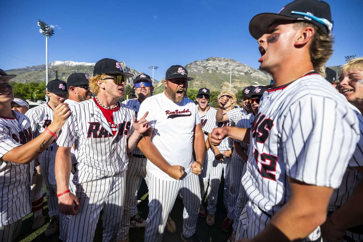 South Sevier head coach Eric Baker, center, celebrates with his players after their win over Kanab during the 2A high school boys baseball championship at Miller Park Complex on the campus of Brigham Young University in Provo on Saturday, May 10, 2025. South Sevier claimed victory in the championship by winning the first game 17-8 and finishing the "if necessary" game with a score of 10-1.
