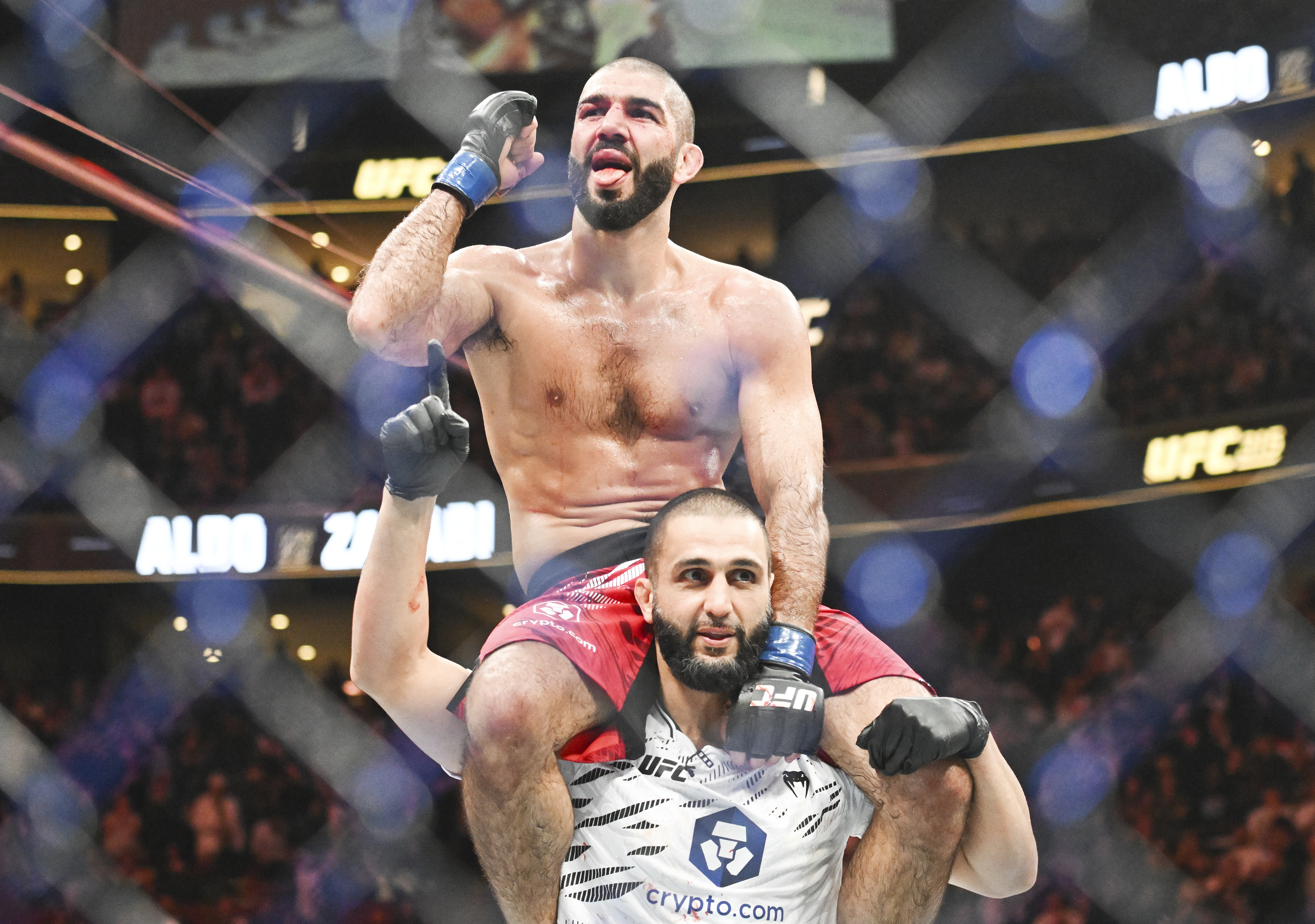 Aiemann Zahabi, top, reacts following his win over Jose Aldo during their UFC 315 mixed martial arts featherweight bout in Montreal, Saturday, May 10, 2025.