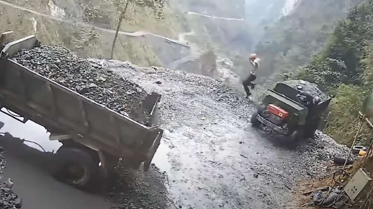 Rather than simply deposit its load somewhere, this truck decided to literally dump itself off the cliff.