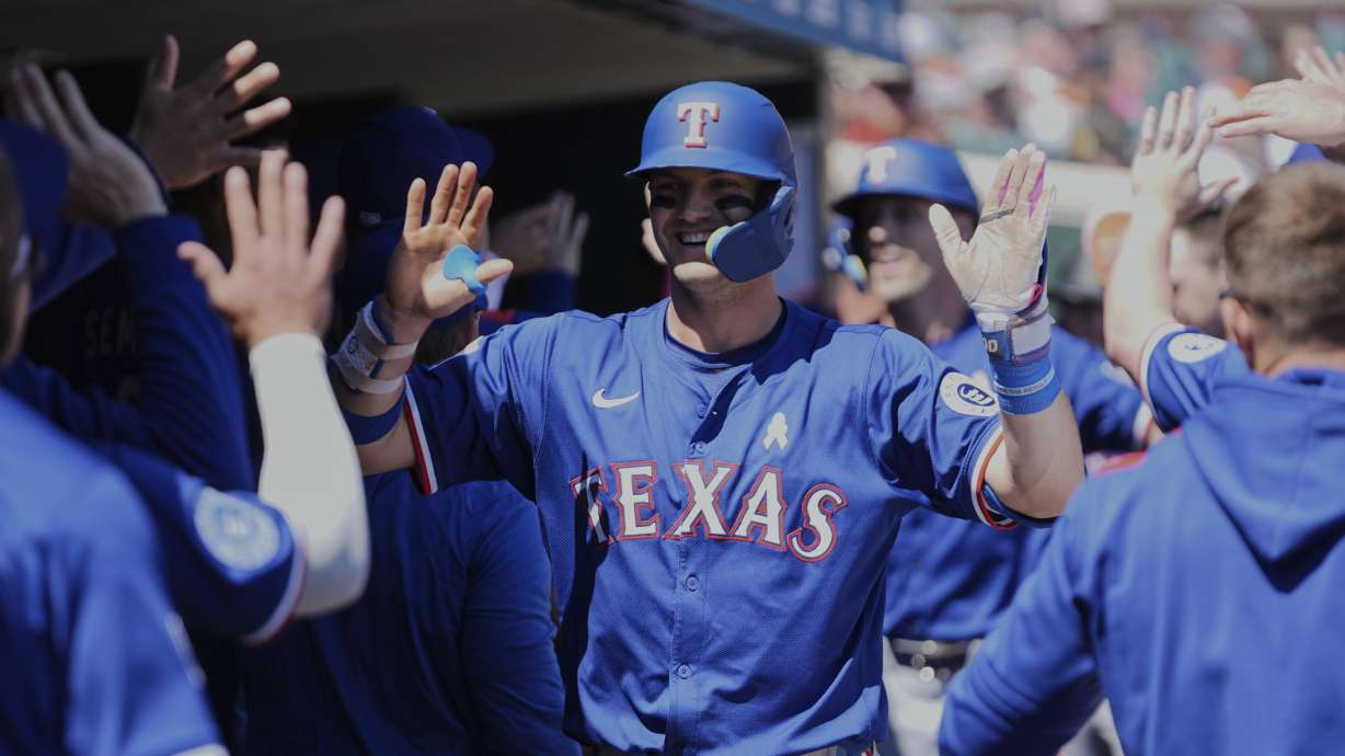 Texas Rangers' Josh Jung celebrates his two-run home run against the Detroit Tigers in the fifth inning during a baseball game, Sunday, May 11, 2025, in Detroit.