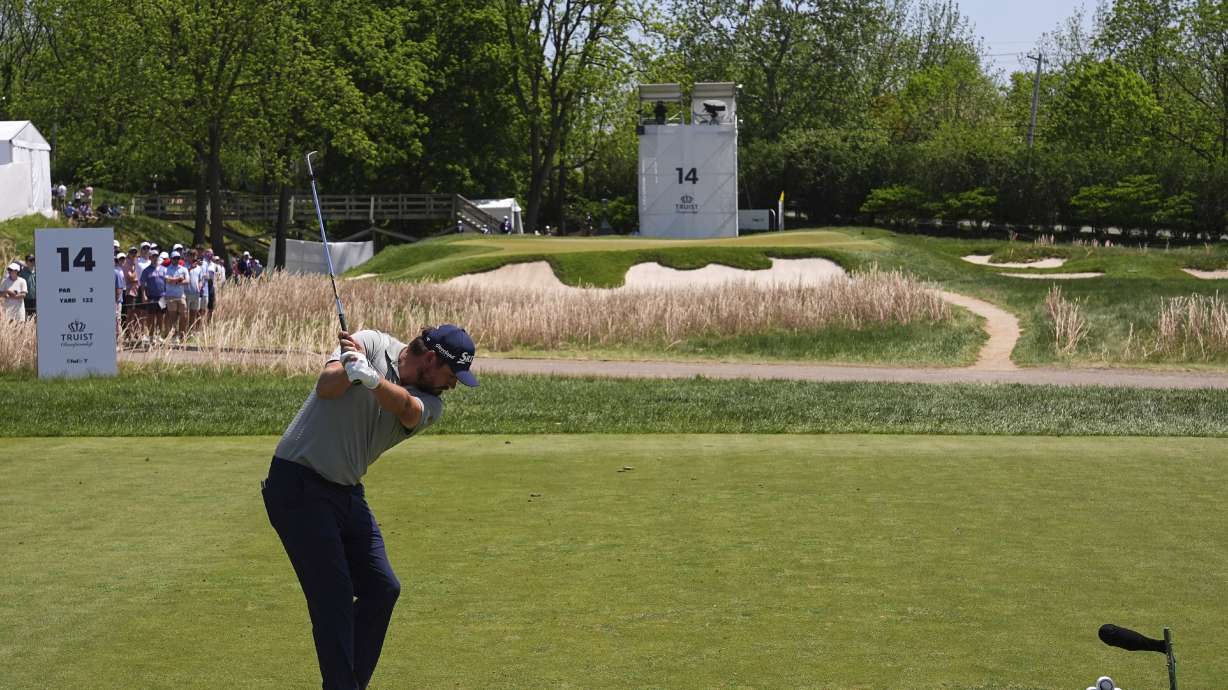 Andrew Novak hits on the 14th hole during the final round of the Truist Championship golf tournament at the Philadelphia Cricket Club, Sunday, May 11, 2025, in Flourtown.