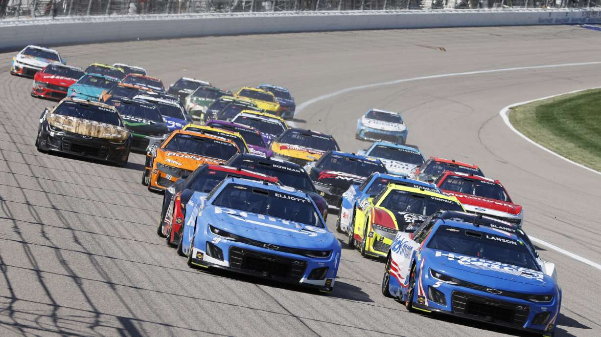 Drivers head through Turn 1 during a NASCAR Cup Series auto race at Kansas Speedway in Kansas City, Kan., Sunday, May 11, 2025.