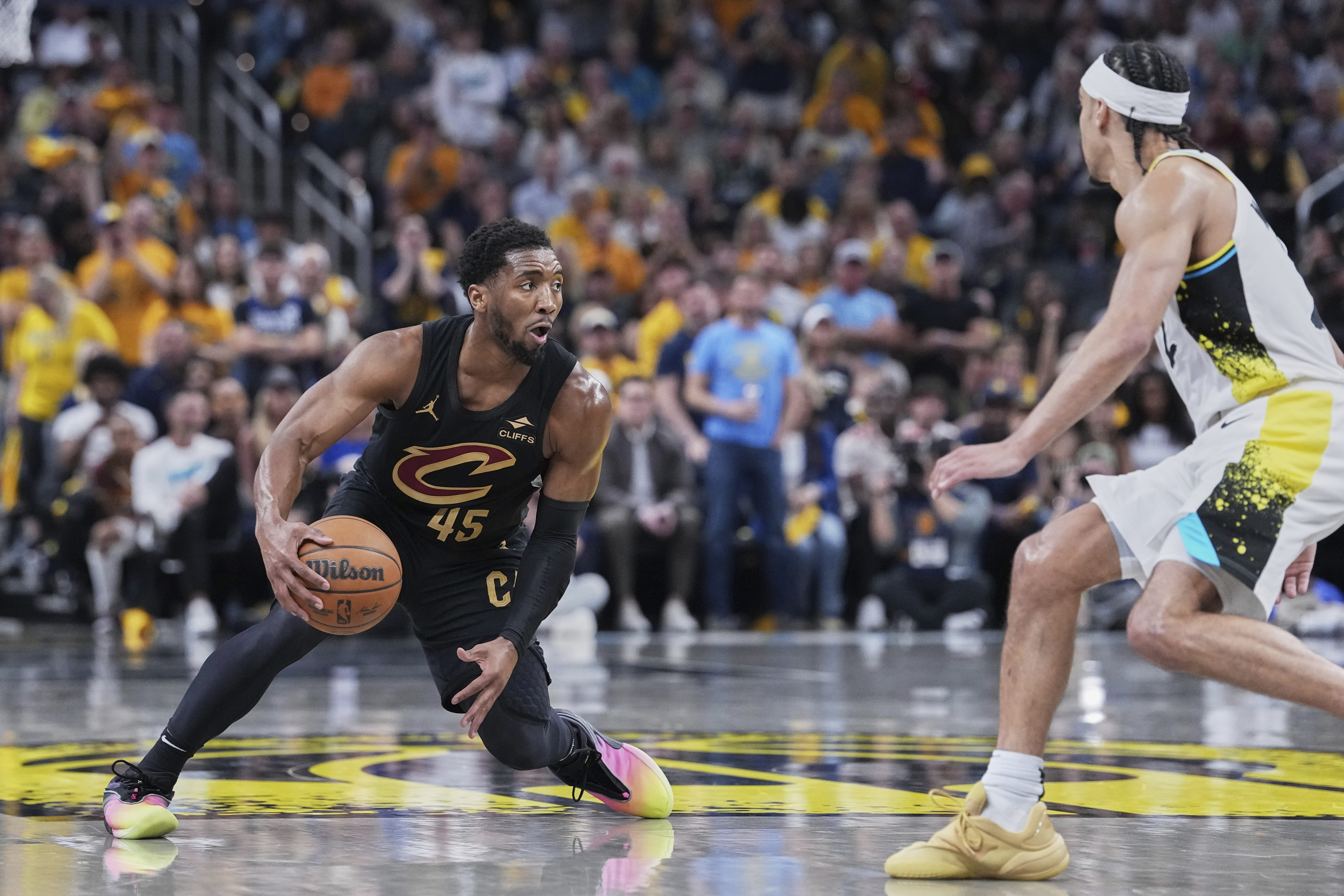 Cleveland Cavaliers guard Donovan Mitchell (45) drives to the basket against Indiana Pacers guard Andrew Nembhard (2) in the first half of Game 4 in the Eastern Conference semifinals of the NBA basketball playoffs in Indianapolis, Sunday, May 11, 2025.