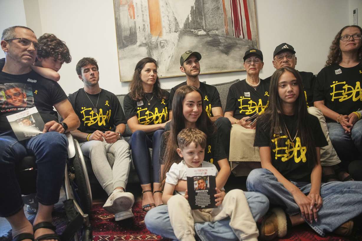 Relatives and friends of Israeli-American soldier Edan Alexander gather to watch the TV broadcast of his release from Hamas captivity in Gaza, in Tel Aviv, Monday. Alexander was abducted during the Hamas-led attack on his base on Oct. 7, 2023.