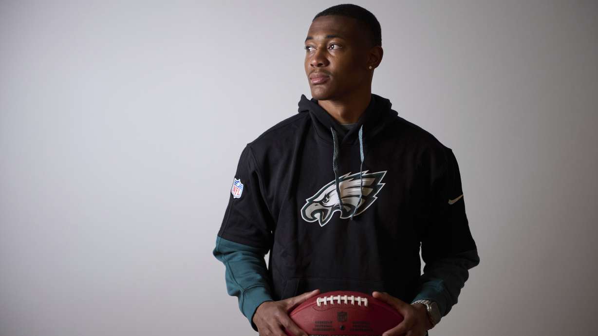 Philadelphia Eagles DeVonta Smith holds the ball as he poses for a photo ahead of an interview with the Associated Press in Barcelona, Spain, Monday, May 12, 2025.