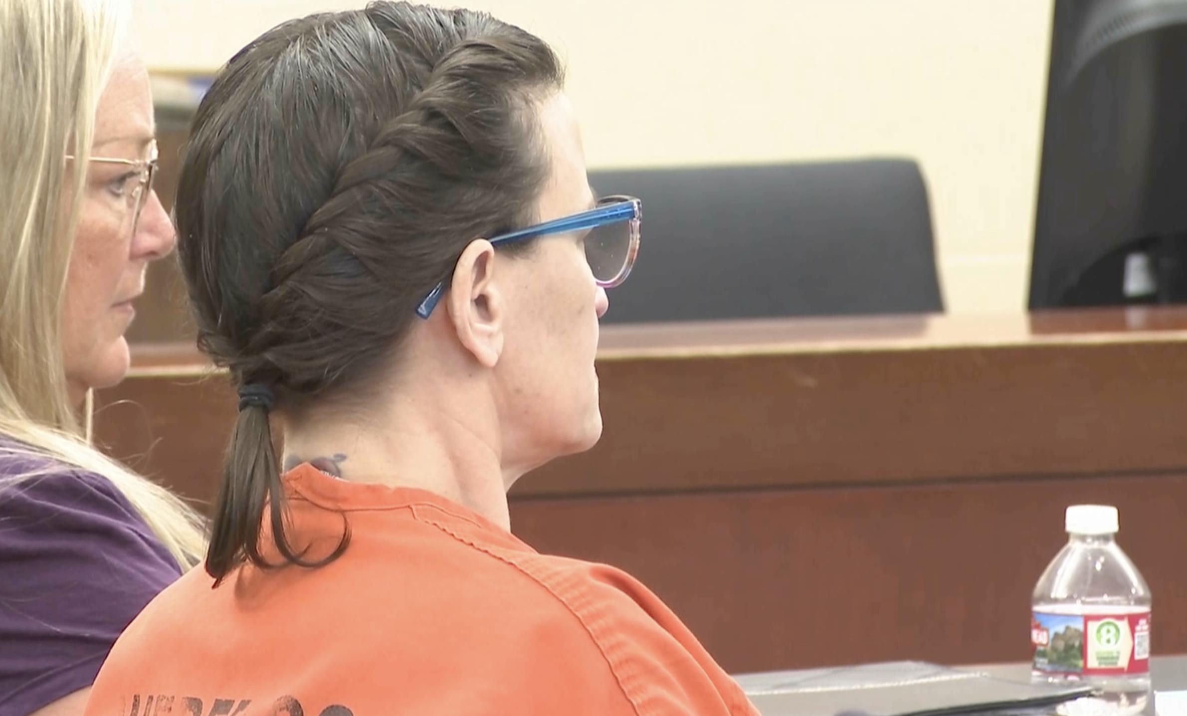 Nichole Scott, stepmother of a 12-year-old West Haven boy who died of sepsis in 2024 after years of abuse and neglect, listens to a judge Monday as she is ordered to spend at least 20 years and up to life in prison after pleading guilty to the boy's murder.