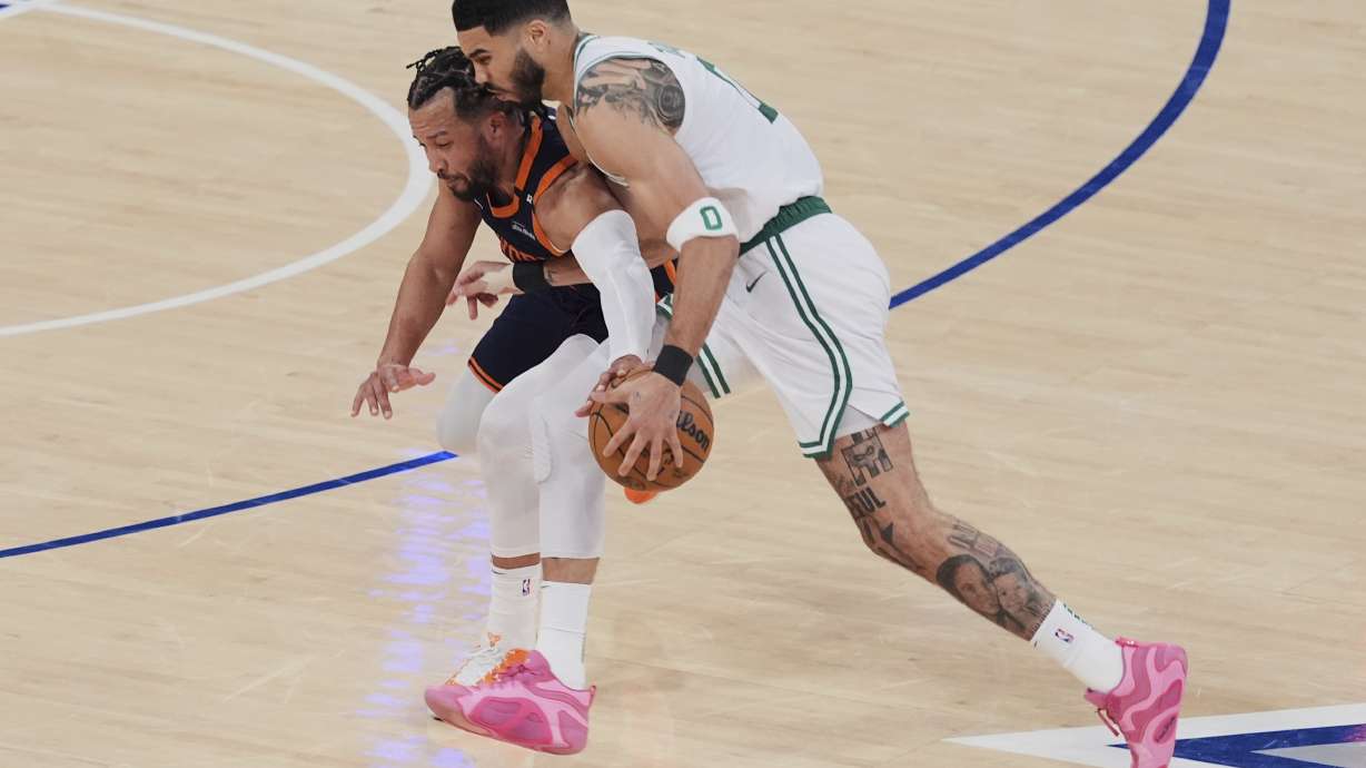 New York Knicks' Jalen Brunson, left, defends Boston Celtics' Jayson Tatum, right, during the first half of Game 4 in the Eastern Conference semifinals of the NBA basketball playoffs Monday, May 12, 2025, in New York.