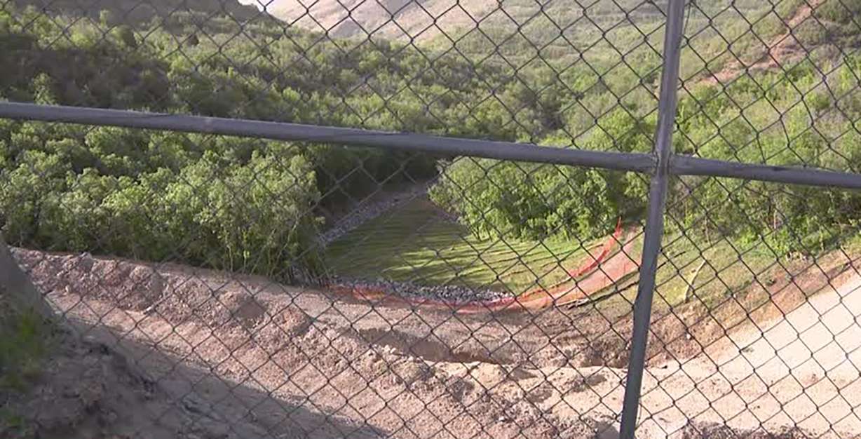 A hole is seen in the Hidden Canyon Estates of Draper after two homes slid off the hillside two years ago. Construction to repair the area should begin soon, Draper officials say.