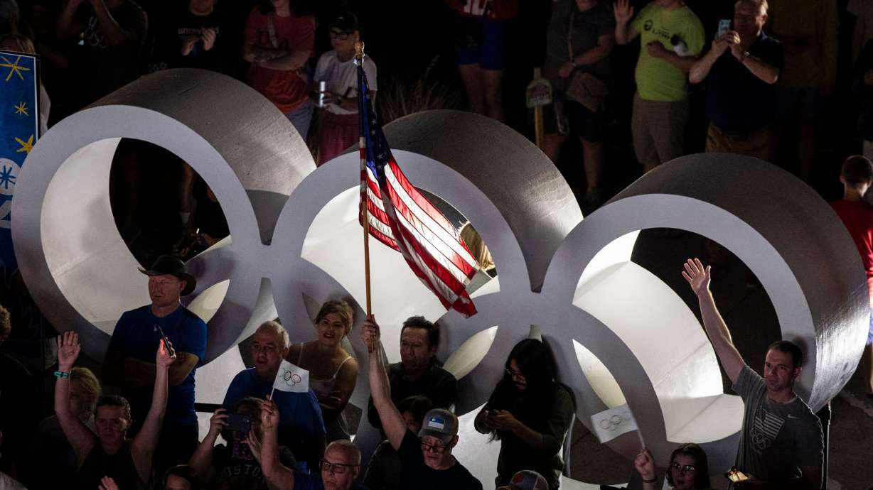 Attendees watch during a live watch party for the Salt Lake City-Utah Committee’s 2034 Winter Olympics bid July 24, 2024, in downtown Salt Lake City. Organizers of the Games are counting on raising even more money from donors.