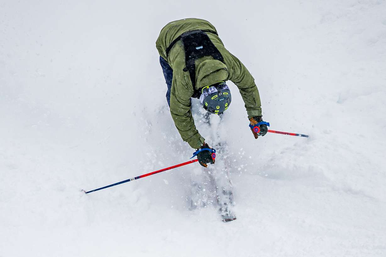 A person crashes while skiing in fresh snow at Solitude Mountain Resort in Brighton on March 6.