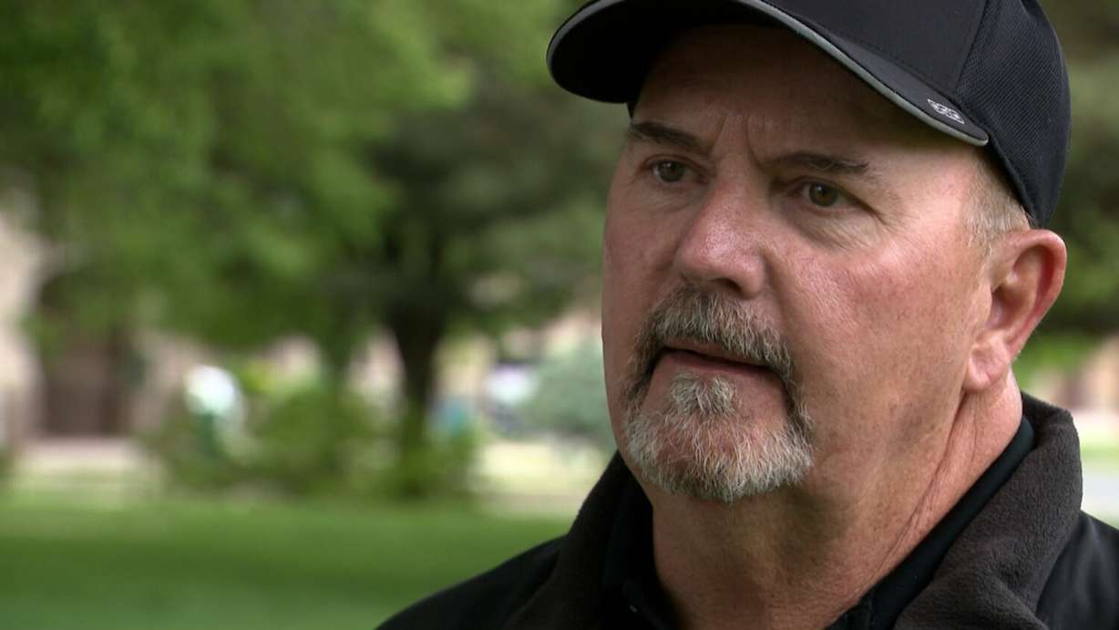 John Butcher, a longtime Sandy city public works employee, was called a hero after he helped an elderly couple during a house fire Monday.