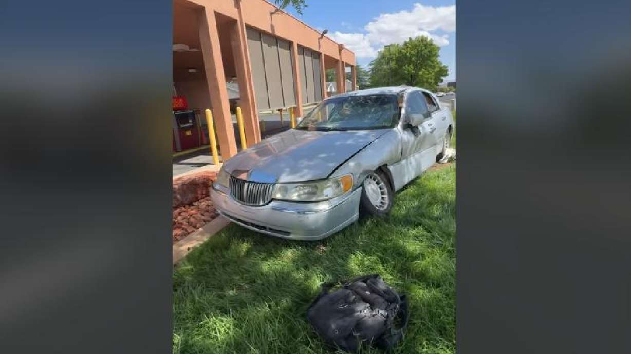 A vehicle is pictured at the scene of a collision in St. George on Tuesday that injured two pedestrians.