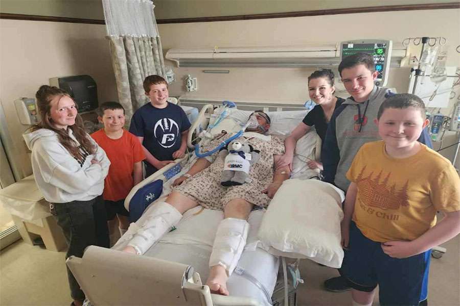 Casey Price in shown in the hospital with his family by his side. He miraculously lived to tell his story of survival after his one-ton truck fell on him April 24, in Osgood, Idaho.