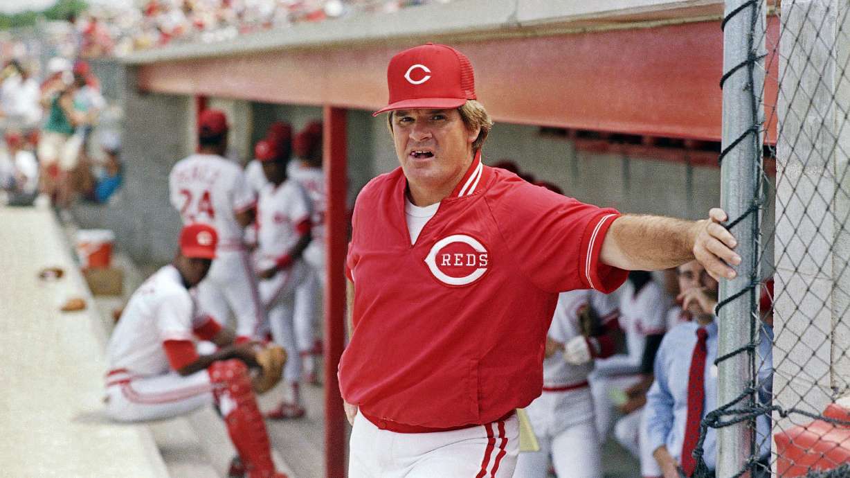 FILE - In this March 22, 1989, file photo, Cincinnati Reds' manager Pete Rose leans against the dugout fence before the start of baseball game in Plant City, Fla.