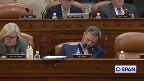 Rep. Blake Moore, R-Utah, sleeps in his chair during a House Ways and Means Committee meeting early May 14, 2025, in Washington, D.C.