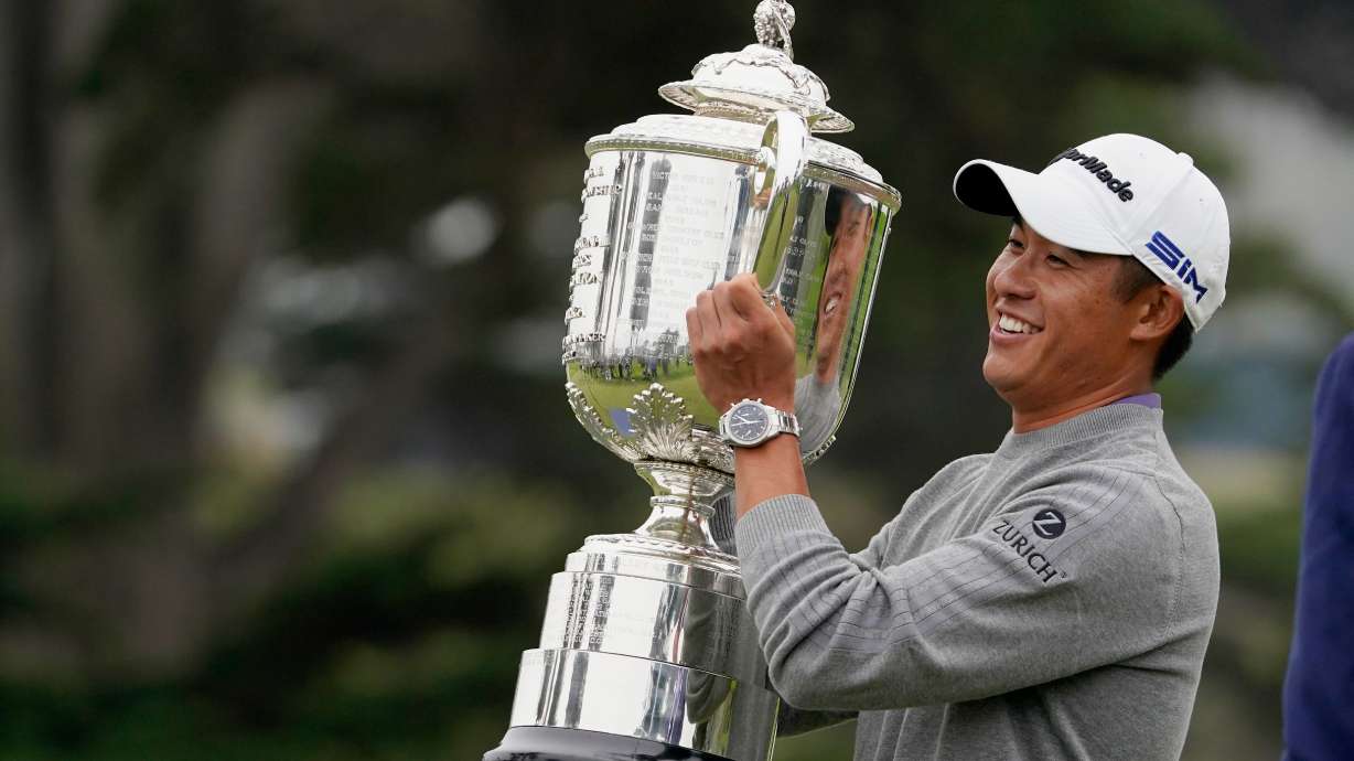 FILE - Collin Morikawa holds the Wanamaker Trophy after winning the PGA Championship golf tournament at TPC Harding Park Sunday, Aug. 9, 2020, in San Francisco.