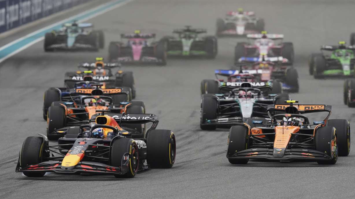 Red Bull driver Max Verstappen of the Netherlands, left, leads the field during the Formula One Miami Grand Prix auto race Sunday, May 4, 2025, in Miami Gardens. Fla.