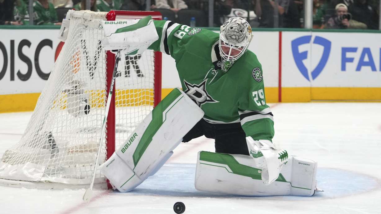 Dallas Stars' Jake Oettinger defends against a shot from the Winnipeg Jets in the second period of Game 3 of a second-round NHL hockey playoff series in Dallas, Sunday, May 11, 2025.