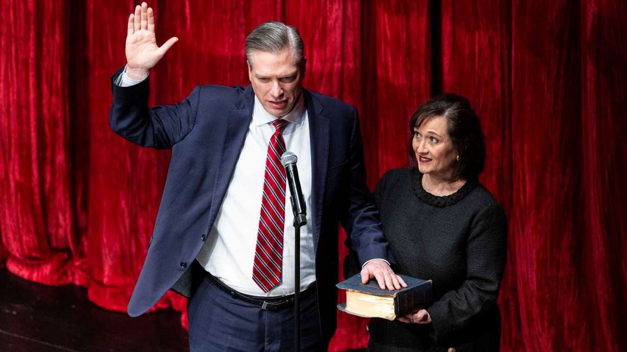 Treasurer Marlo Oaks, by his wife, Elaine Oaks, as he takes the oath of office in Salt Lake City on Jan. 8. Marlo Oaks spoke about the attempt to politicize treasuries across all levels of government Wednesday.