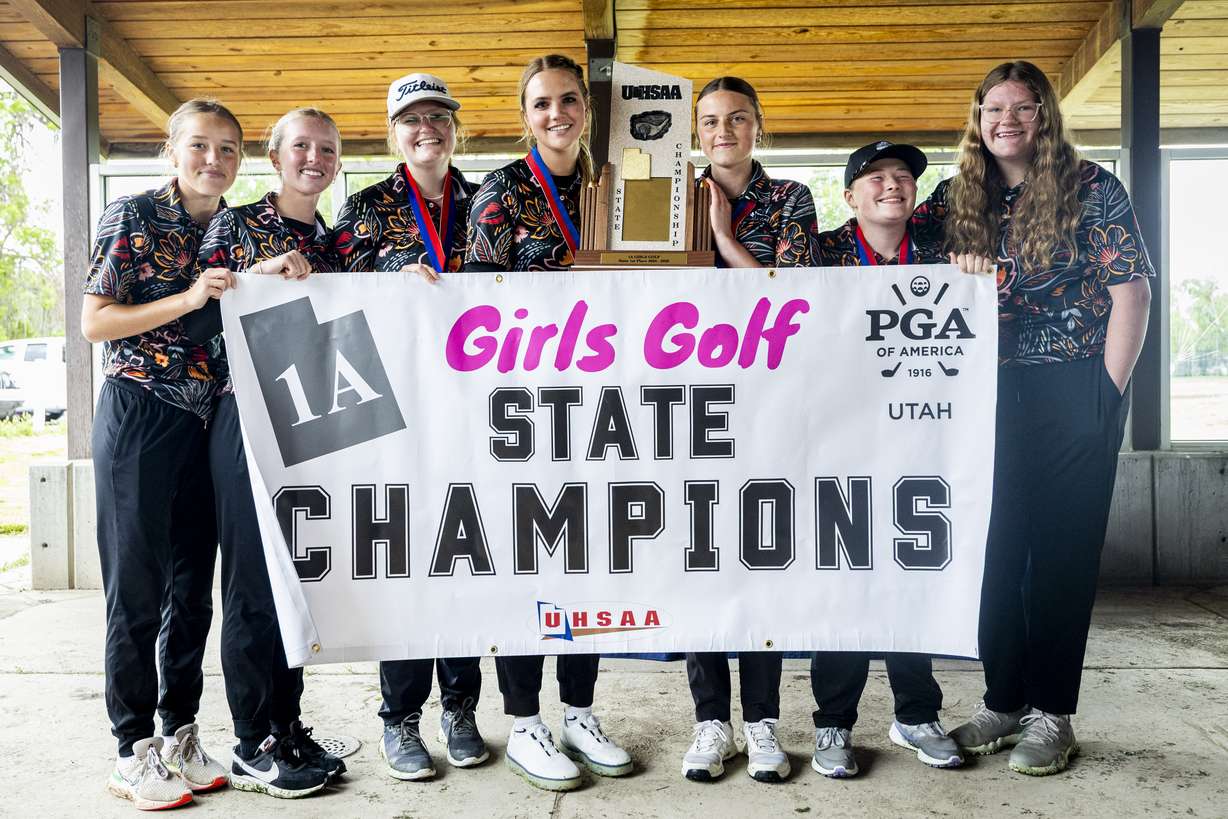Monticello golfers pose with the team championship trophy after winning the 1A girls high school golf state championship held at Mountain View Golf Course in West Jordan on Wednesday, May 14, 2025.