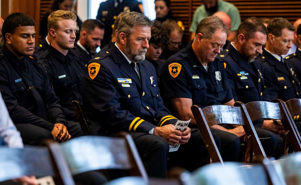 Salt Lake City police officers take part in a moment of silence at a ceremony to honor the lives of the 25 police officers who have died in the line of duty throughout the Salt Lake City Police Department’s history, at the Public Safety Building in Salt Lake City on Wednesday.