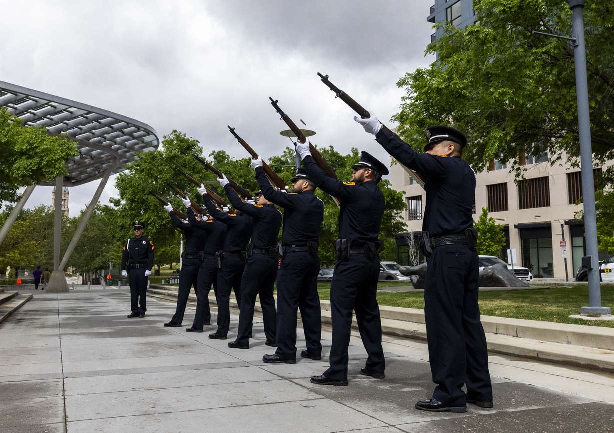Members of the Salt Lake City SWAT Team fire a three-round volley at a ceremony to honor the lives of the 25 police officers who have died in the line of duty throughout the Salt Lake City Police Department’s history, at the Public Safety Building in Salt Lake City on Wednesday.