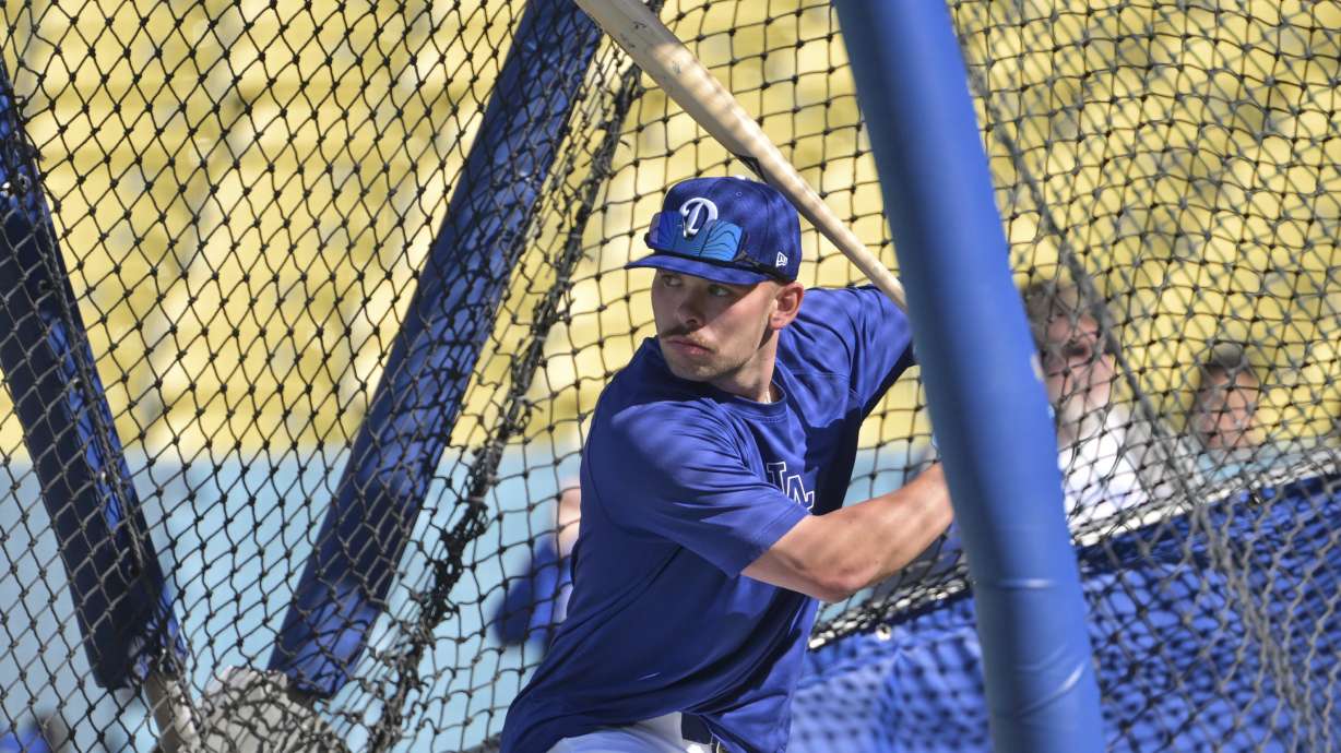 Los Angeles Dodgers' Dalton Rushing waits on a pitch as he participates in batting practice before a baseball game against the Oakland Athletics, Wednesday, May 14, 2025, in Los Angeles.