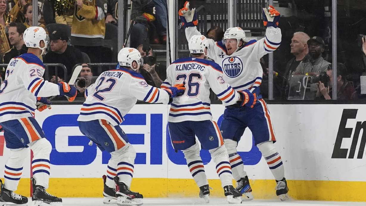 Edmonton Oilers right wing Kasperi Kapanen, right, celebrates with teammates after scoring against the Vegas Golden Knights during overtime of Game 5 of a second-round NHL hockey playoff series Wednesday, May 14, 2025, in Las Vegas.