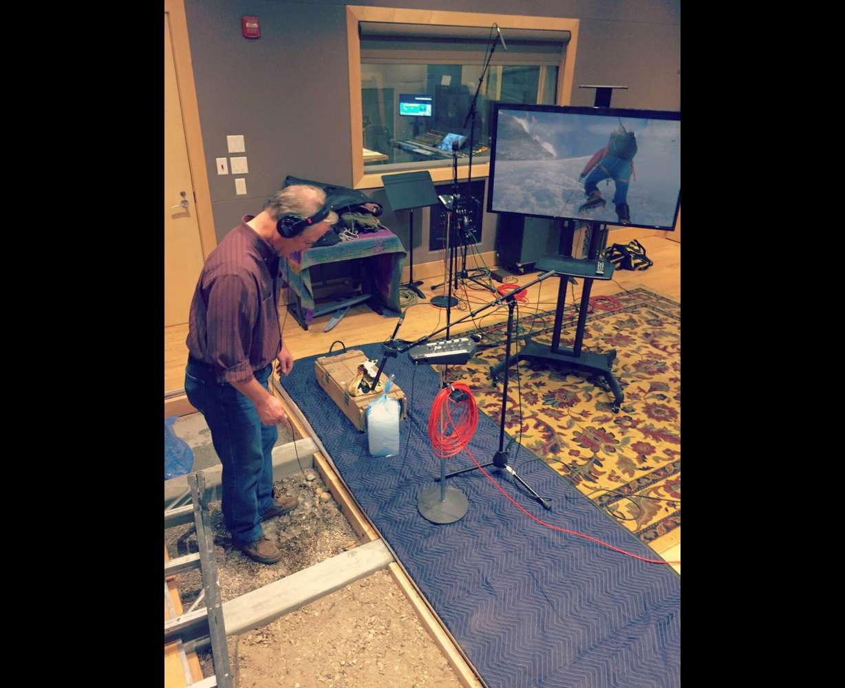 Ryan Purcell is shown in the studio. Purcell is a foley artist, someone who recreates common sounds synchronized to the picture for movies and TV shows.