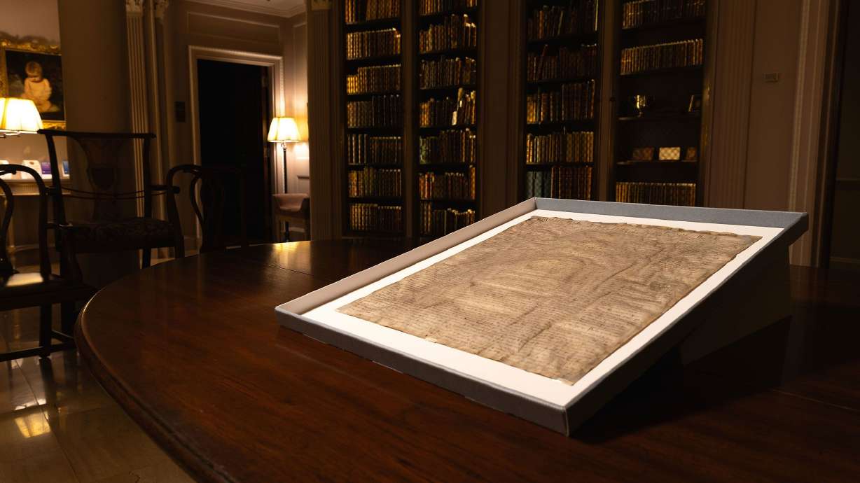 A rare copy of Magna Carta from 1300 sits in a display case at Harvard Law School in Cambridge, Mass., on April 15. It was purchased decades ago for $27.50.