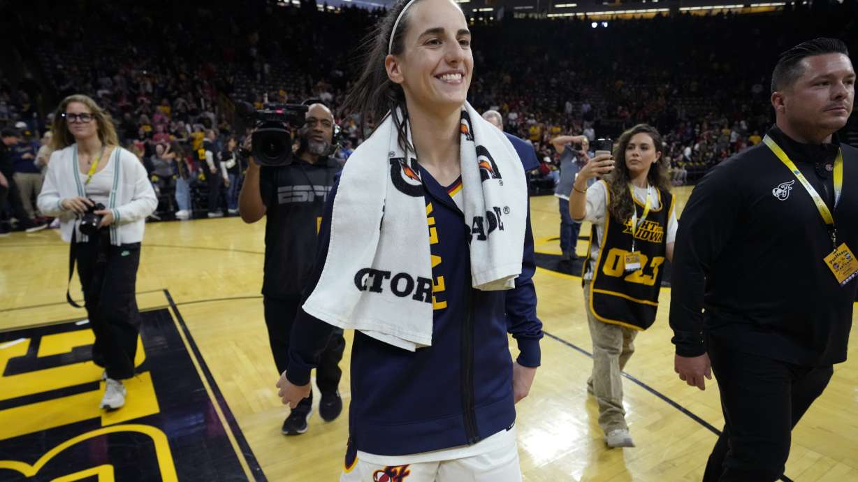 Indiana Fever guard Caitlin Clark, center, walks off the court after an exhibition women's basketball game against Brazil, Sunday, May 4, 2025, in Iowa City, Iowa.
