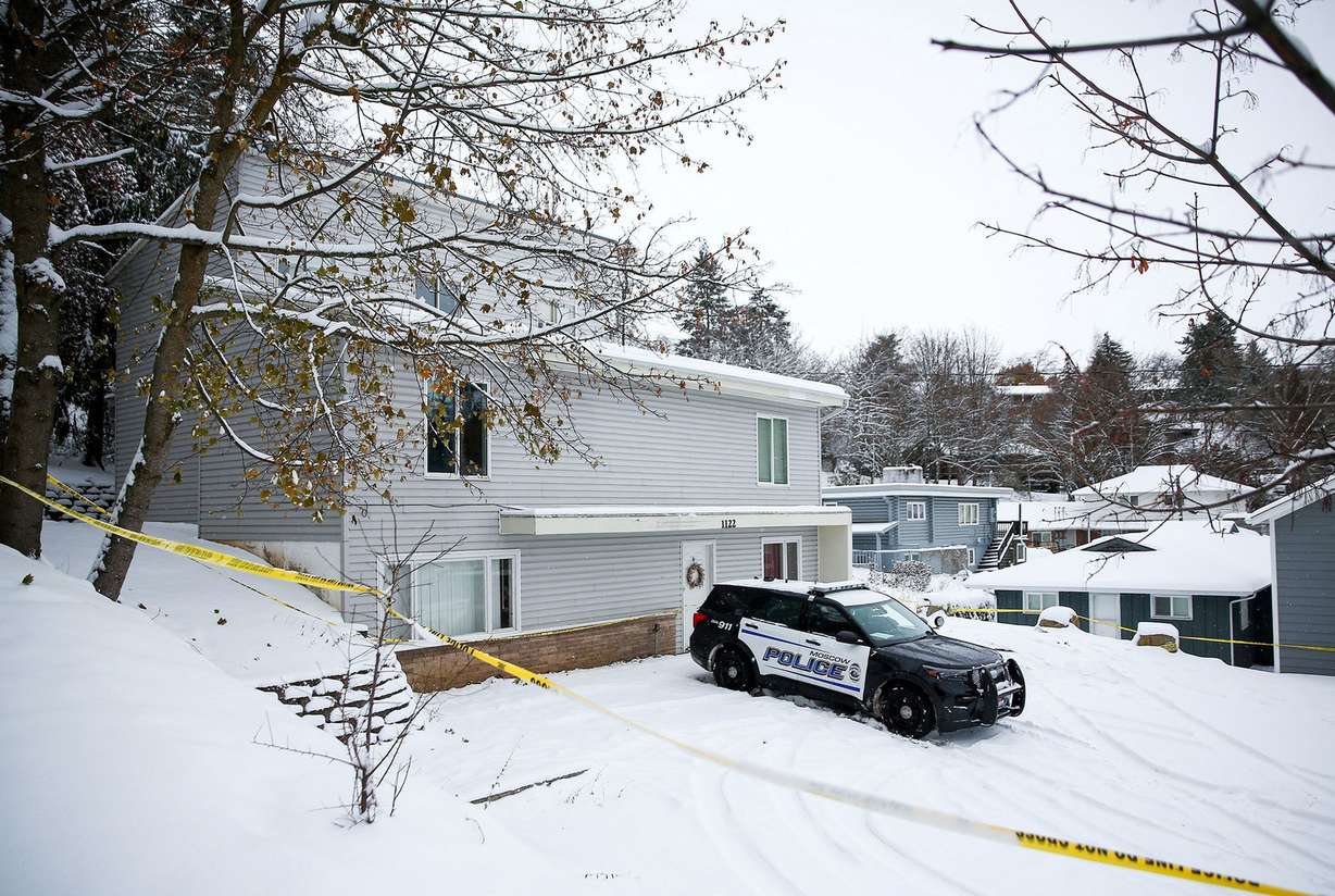 Police tape surrounds the residence where four University of Idaho students were killed as police monitor the scene on Nov. 30, 2022, in Moscow, Idaho.