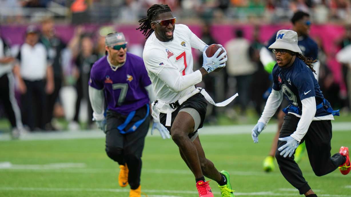 FILE - AFC wide receiver Brian Thomas Jr. (7), of the Jacksonville Jaguars, runs away from NFC return specialist KaVontae Turpin, of the Dallas Cowboys, right, during the flag football event at the NFL Pro Bowl, Sunday, Feb. 2, 2025, in Orlando.