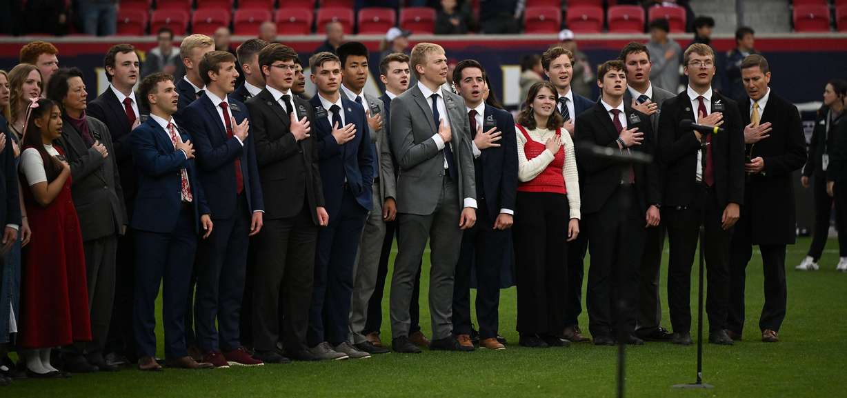 Missionaries from The Church of Jesus Christ of Latter-day Saints sing the national anthem prior to Real Salt Lake and the Portland Timbers playing at America First Field in Sandy on Wednesday.