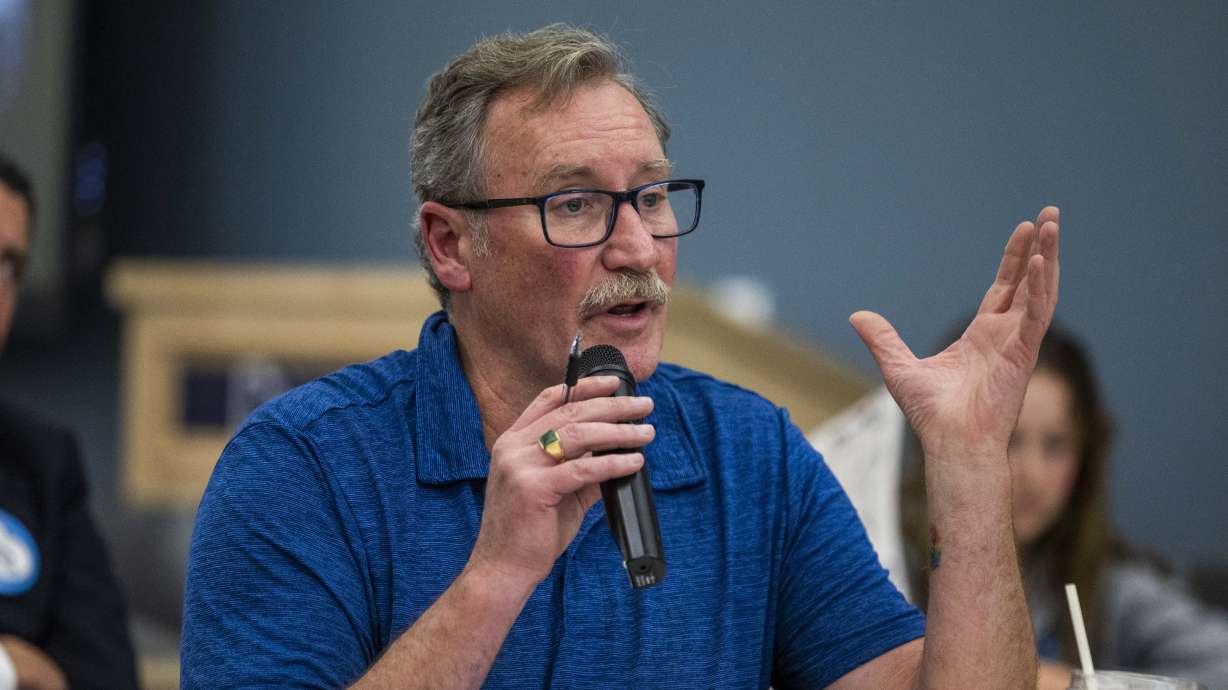 Jahn Curran speaks against a proposal to impose work reporting requirements on Medicaid recipients in Salt Lake City on Wednesday. Curran, who is battling cancer, said it is difficult to meet work requirements while treating his cancer.