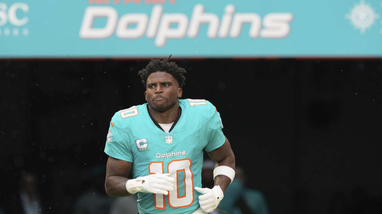 FILE - Miami Dolphins wide receiver Tyreek Hill (10) enters the field before an NFL football game against the San Francisco 49ers, Sunday, Dec. 22, 2024, in Miami Gardens, Fla.