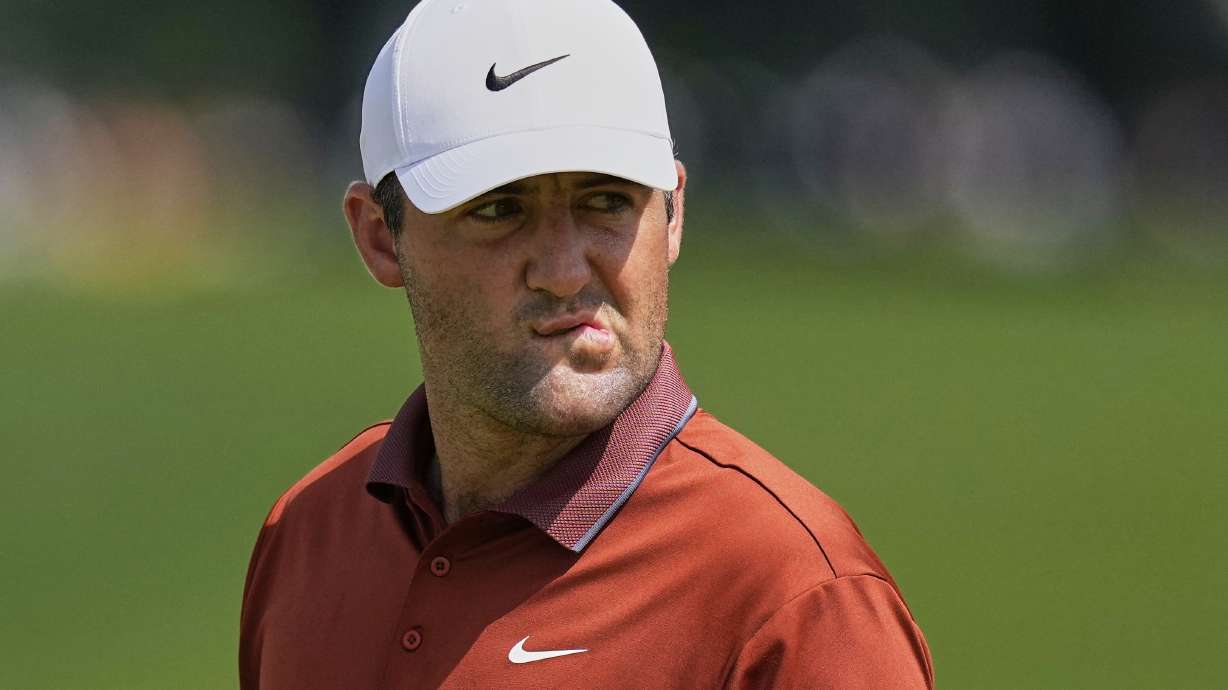 Scottie Scheffler reacts after the 16th hole during the first round of the PGA Championship golf tournament at the Quail Hollow Club, Thursday, May 15, 2025, in Charlotte, N.C.