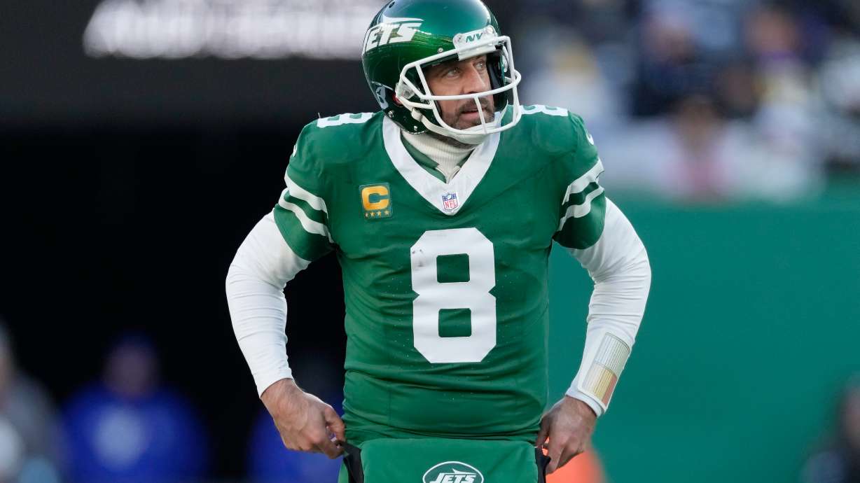 FILE - New York Jets quarterback Aaron Rodgers (8) reacts during the second half of an NFL football game against the Los Angeles Rams in East Rutherford, N.J., Sunday, Dec. 22, 2024.