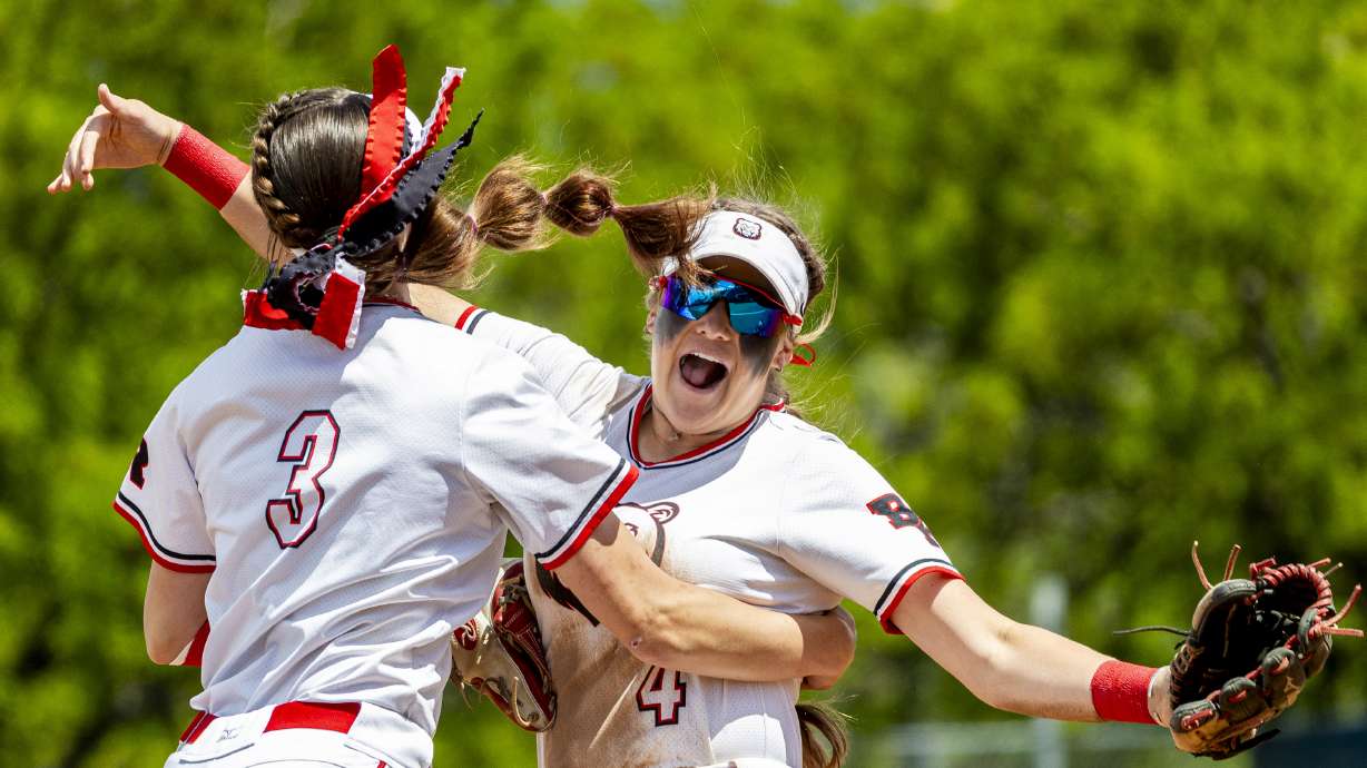 Bear River's Luci Roche (4) and outfielder Bostyn Lish (3) celebrate at the end of an inning during the first game of the championship series in the 4A high school softball state tournament against Desert Hills held at Miller Park on the campus of Brigham Young University in Provo on Thursday, May 15, 2025.