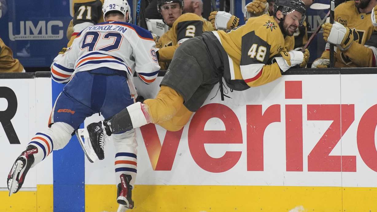 Edmonton Oilers right wing Vasily Podkolzin (92) checks Vegas Golden Knights center Tomas Hertl (48) during the first period of Game 5 of a second-round NHL hockey playoff series Wednesday, May 14, 2025, in Las Vegas.