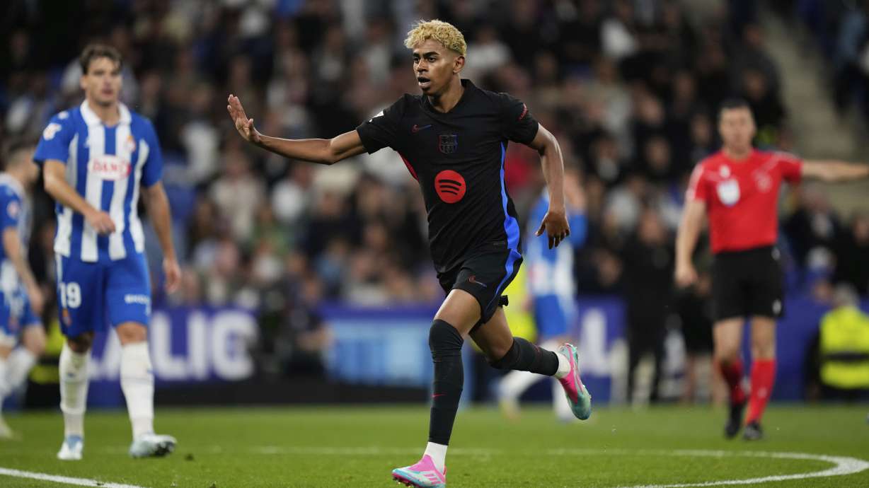 Barcelona's Lamine Yamal reacts after scoring during a Spanish La Liga soccer match between Espanyol and Barcelona in Barcelona, Spain, Thursday, May 15, 2025.