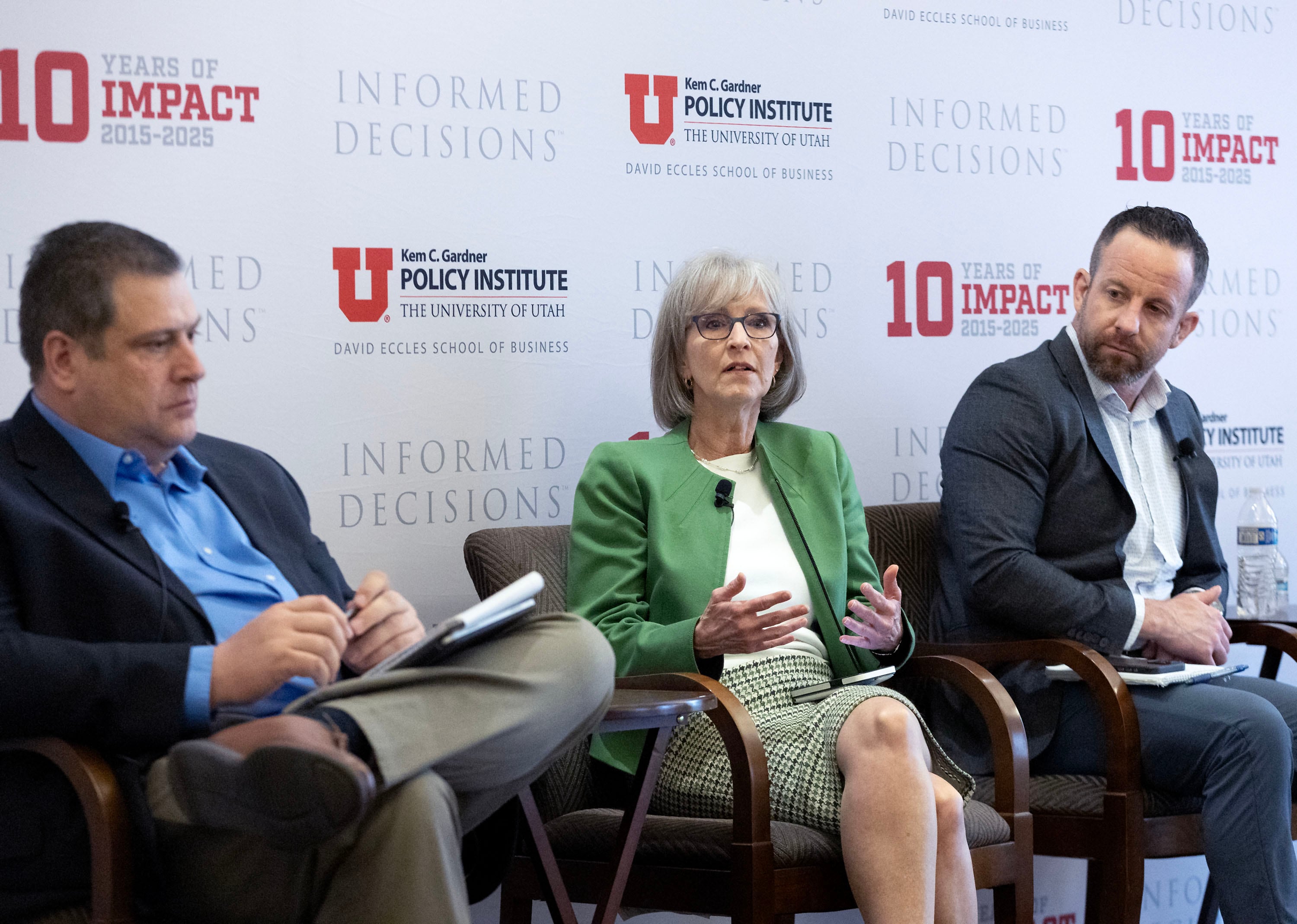 Kyle Snow of the Utah Behavioral Health Commission, Angela Kimball of Inseparable, and Jordan Sorenson of the Utah Hospital Association speak at the Thomas S. Monson Center in Salt Lake City on Thursday.