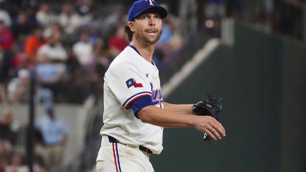 Texas Rangers starting pitcher Jacob deGrom watches a hit ball go foul during the seventh inning of a baseball game against the Houston Astros, Thursday, May 15, 2025, in Arlington, Texas.