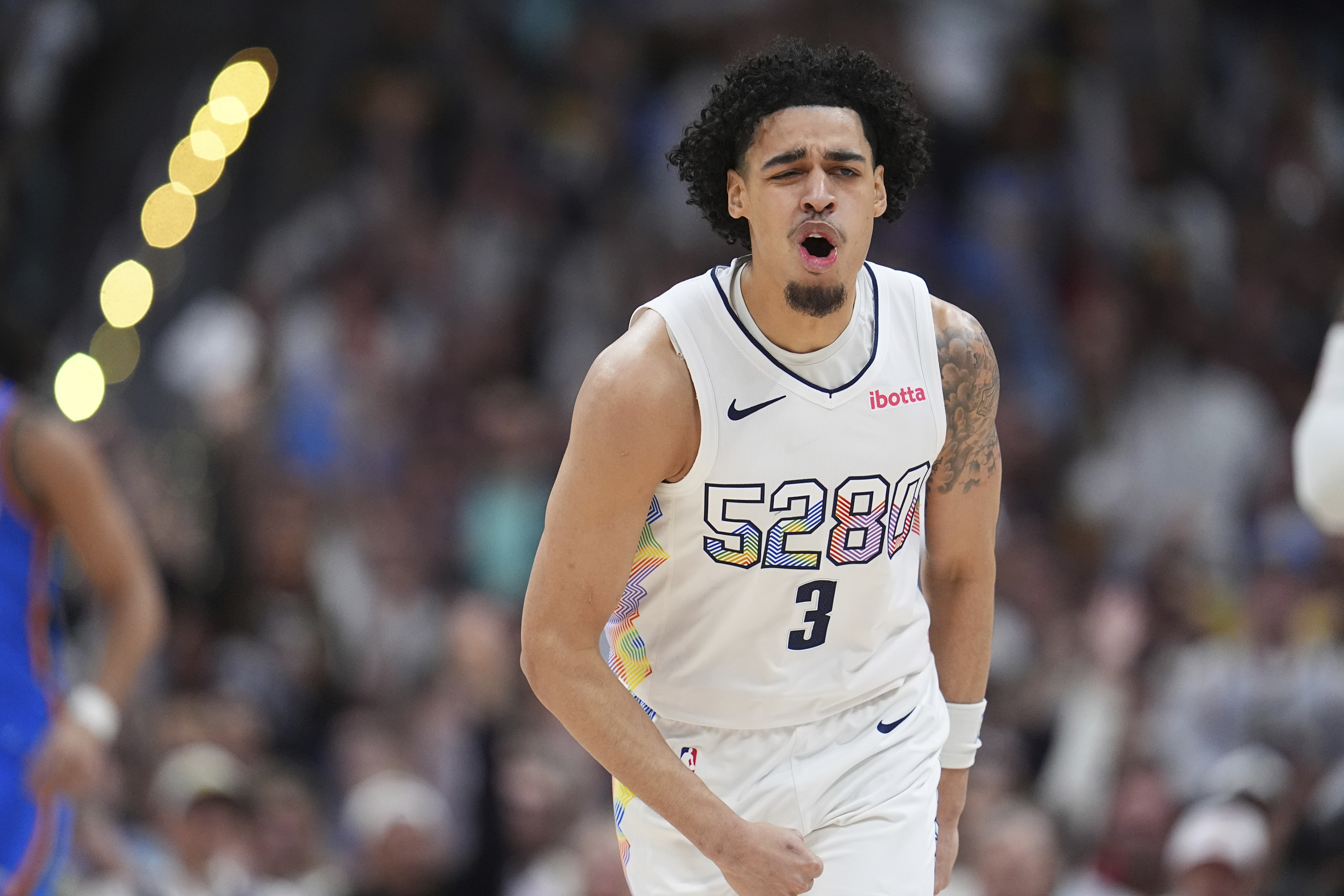 Denver Nuggets guard Julian Strawther reacts after hitting a 3-point basket in the second half of Game 6 in the Western Conference semifinals of the NBA basketball playoffs against the Oklahoma City Thunder Thursday, May 15, 2025, in Denver.