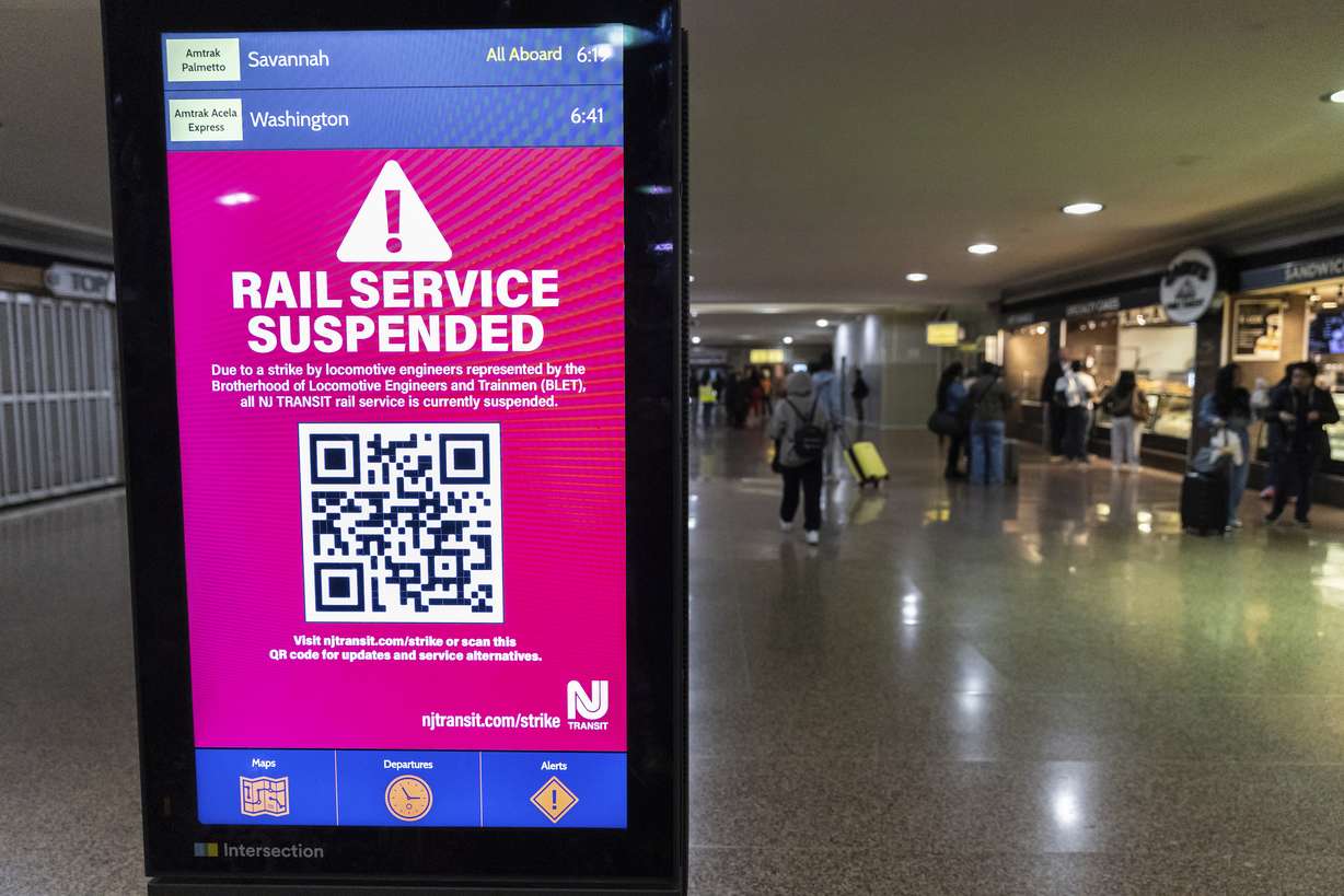 An information screen informing commuters of the rail service suspension, due to the strike by Union members from the Brotherhood of Locomotive Engineers and Trainmen, inside Newark Penn Station on Friday, in Newark, New Jersey.
